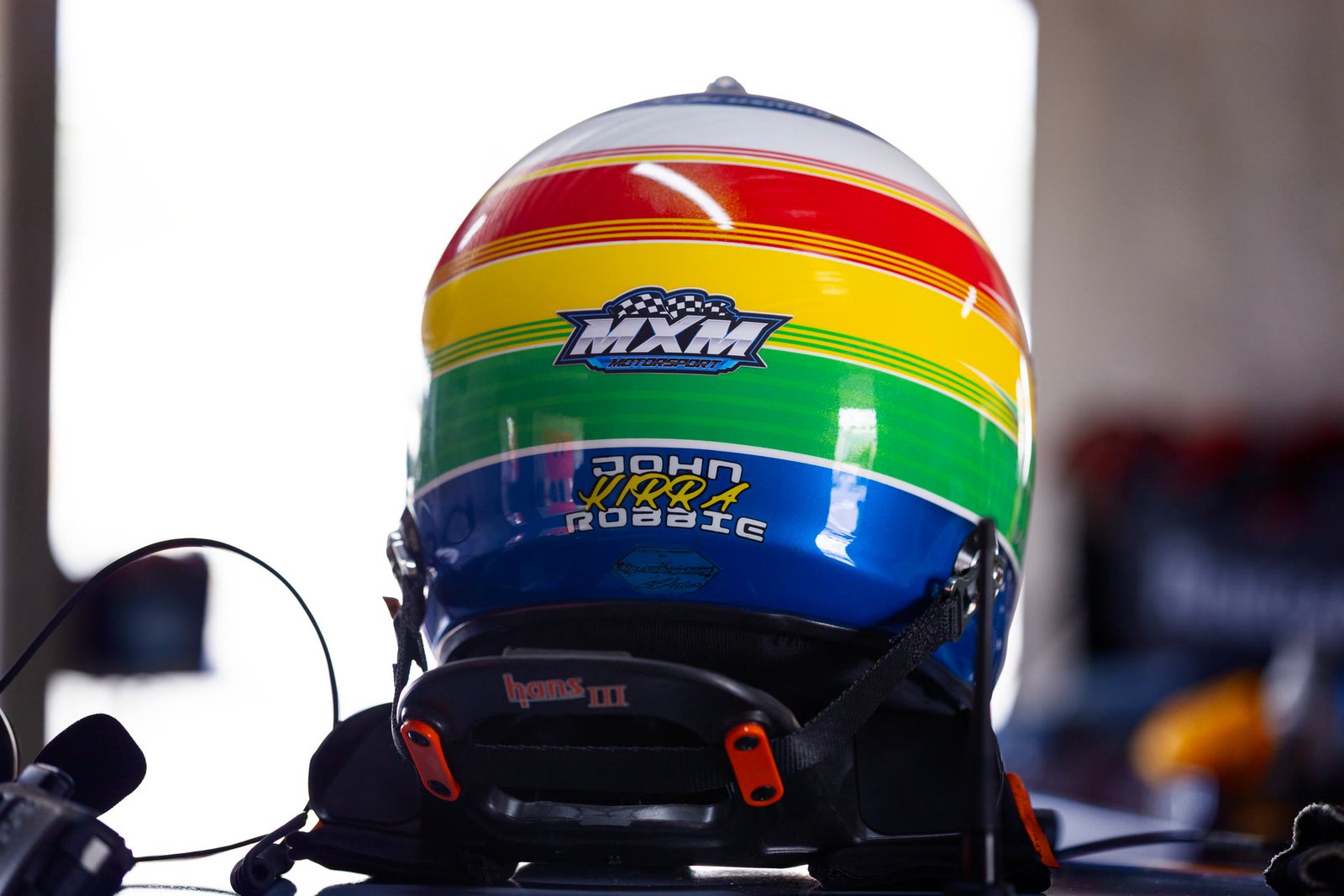 Ian McMah's rainbow helmet in the garage at Queensland Raceway.